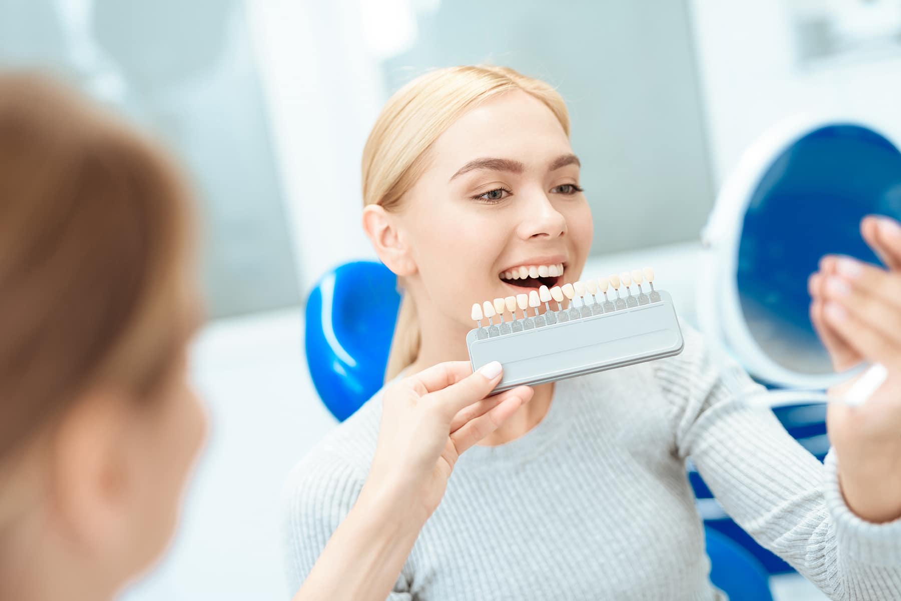 Woman getting cosmetic dental procedures in Battle Creek, MI