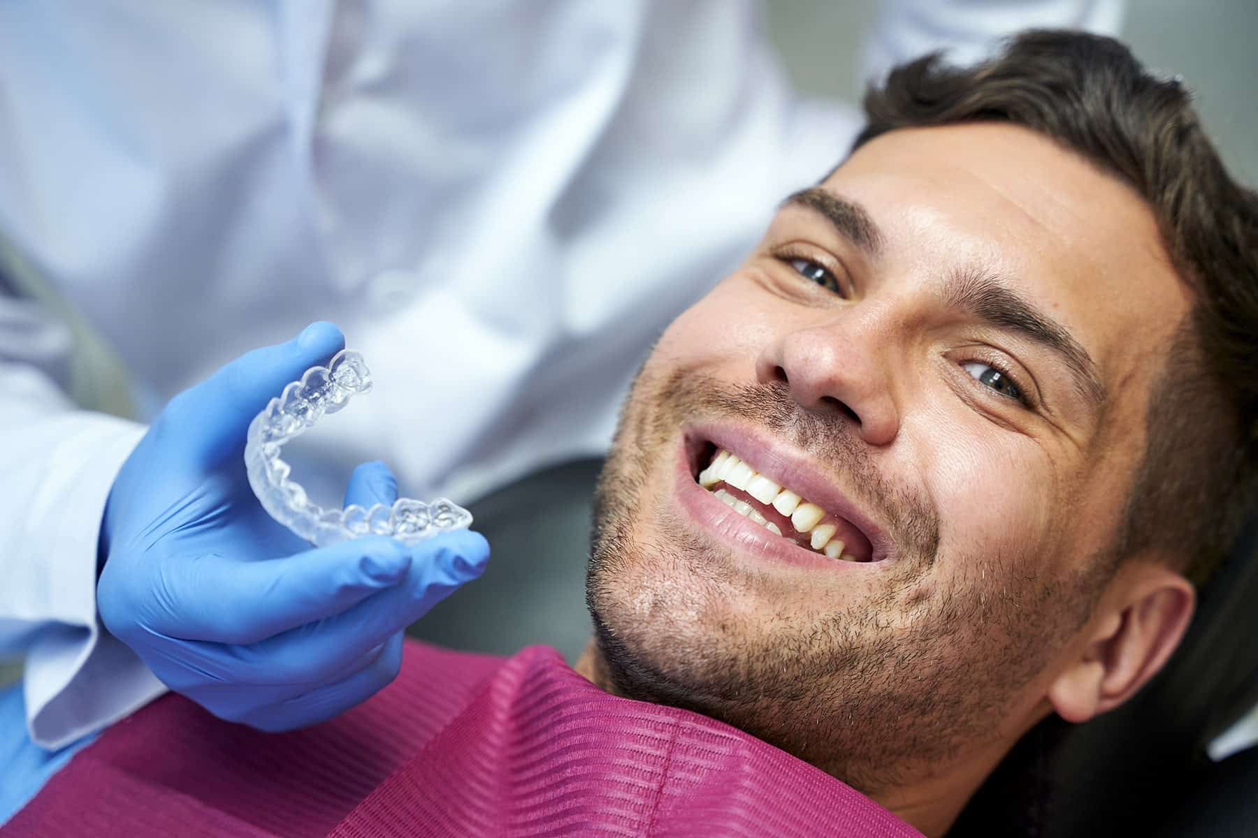 Man smiling at the clear aligner dentist in Battle Creek, MI